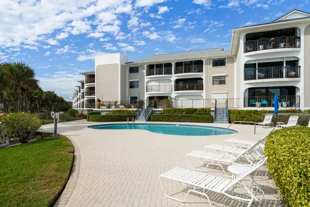 a view of swimming pool with a yard