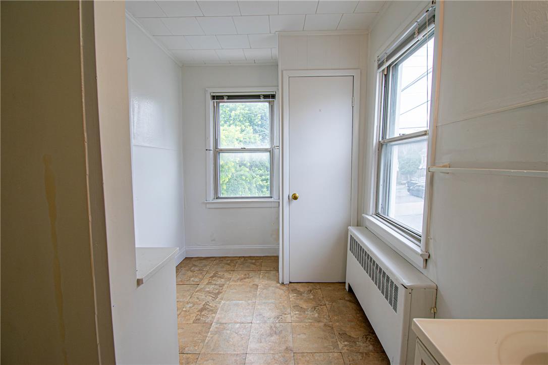 27 West Allen Street Allentown, PA 18102 - Photo 19 of 26 A well-lit, compact utility space offers practical storage and window views.