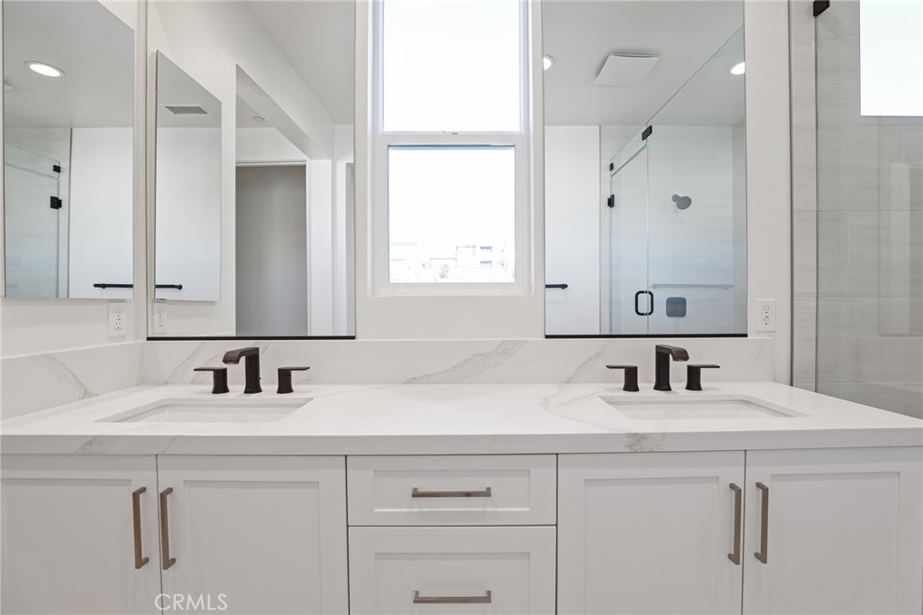 732 Jasper Street Rancho Mission Viejo, CA 92694 - Photo 22 of 28 a bathroom with a sink and a mirror
