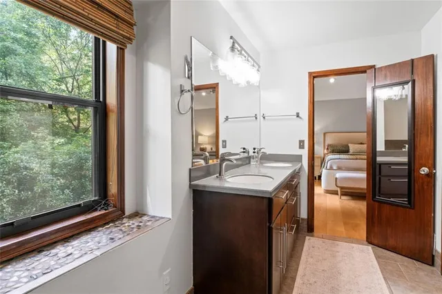 a kitchen with sink cabinets and refrigerator