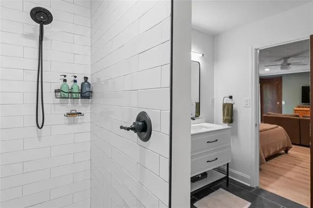a en suite bathroom with a sink and a mirror