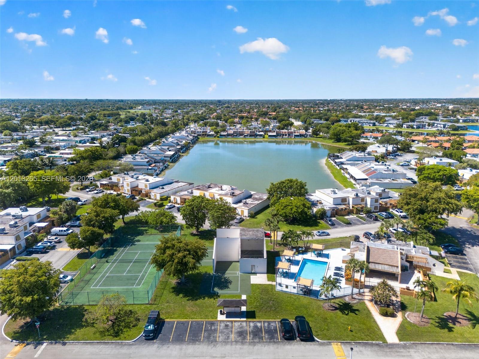 13189 Southwest 9th Lane Miami, FL 33184 - Photo 24 of 24 an aerial view of a city with lots of residential buildings and ocean view in back
