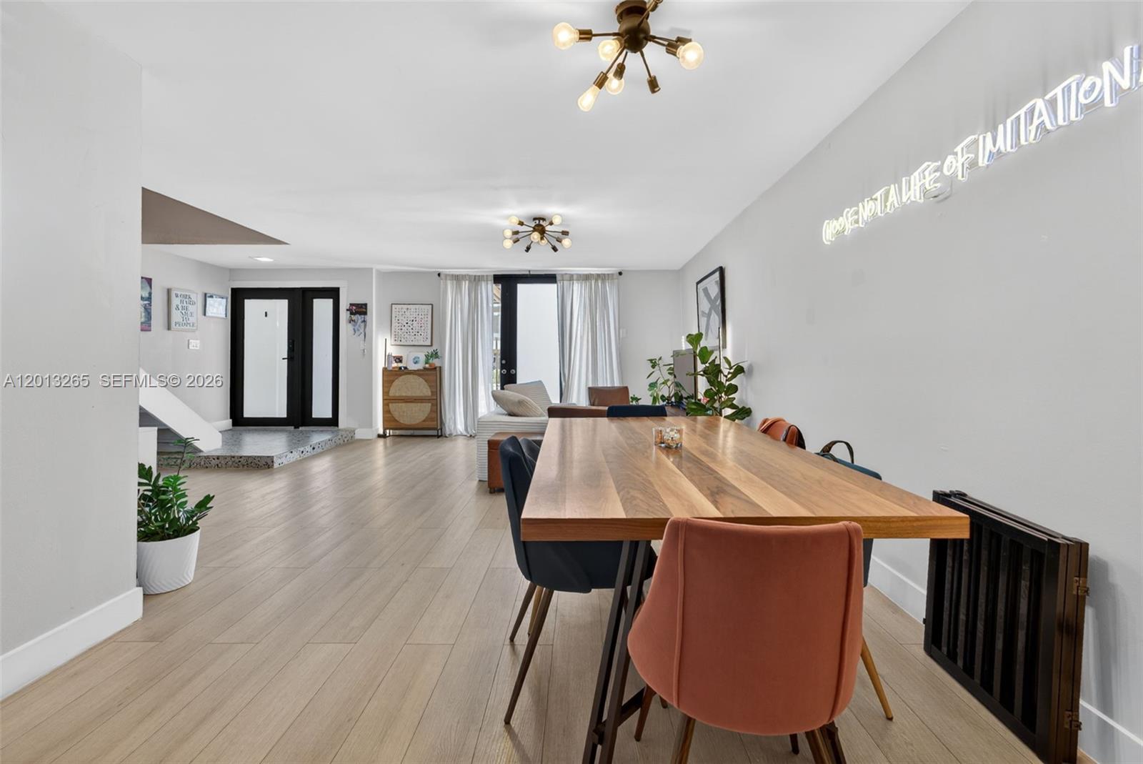13189 Southwest 9th Lane Miami, FL 33184 - Photo 4 of 24 a view of a dining room with furniture and wooden floor