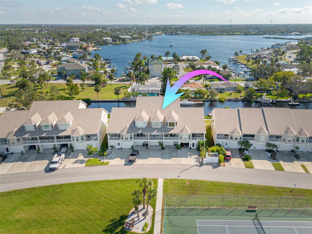 an aerial view of a house with a swimming pool