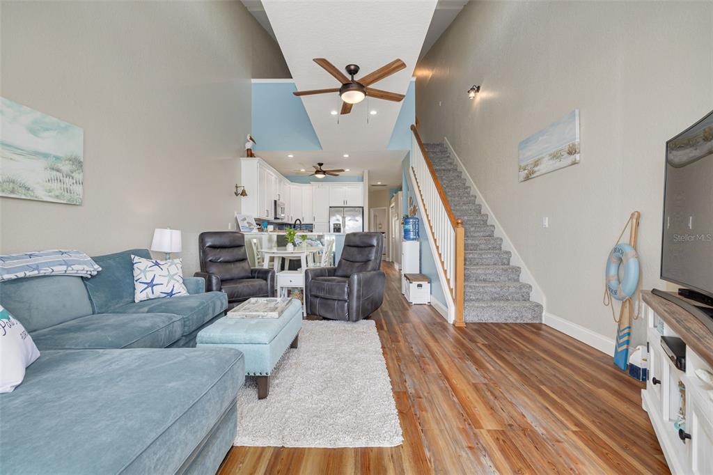 8246 Aquila Street Port Richey, FL 34668 - Photo 15 of 43 a living room with furniture and a wooden floor