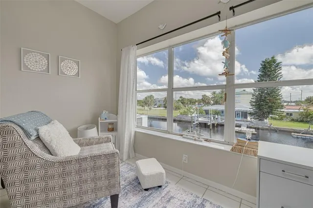 a spacious bedroom with a bed and a mirror