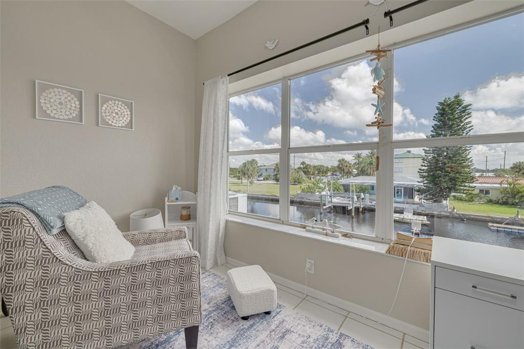 8246 Aquila Street Port Richey, FL 34668 - Photo 19 of 43 a living room with furniture and a large window