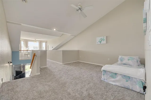 a dining room with furniture water view and a floor to ceiling window
