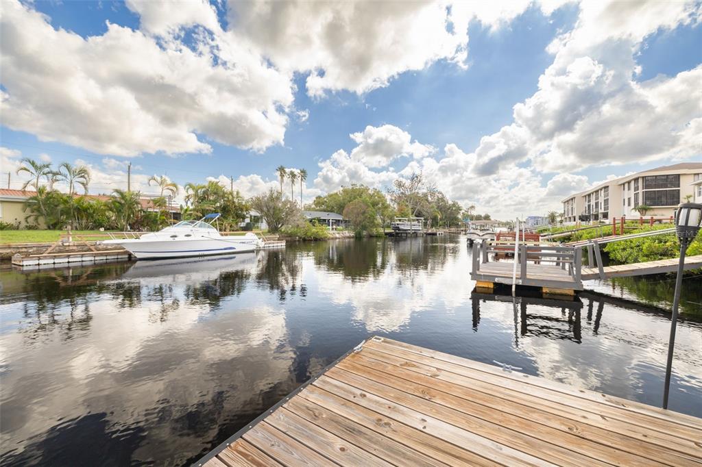 8246 Aquila Street Port Richey, FL 34668 - Photo 33 of 43 a view of a lake with boats and trees