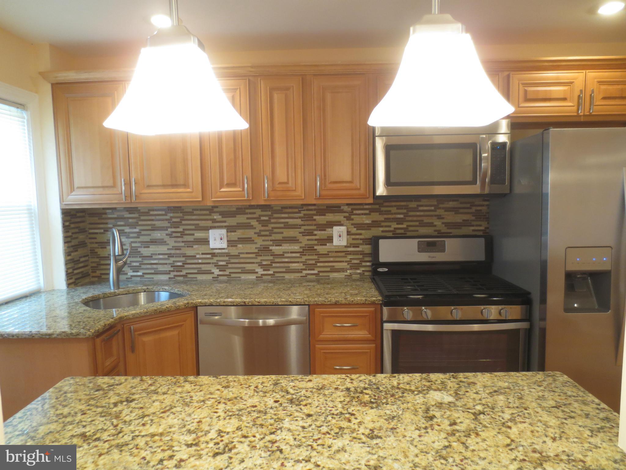 1524 Medford Road Baltimore, MD 21218 - Photo 26 of 28 View of Kitchen from Breakfast Bar