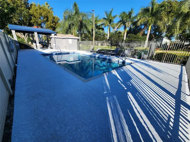 a view of balcony with wooden floor and outdoor seating