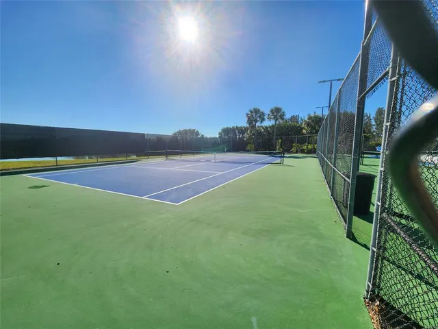 a view of an outdoor space and tennis court