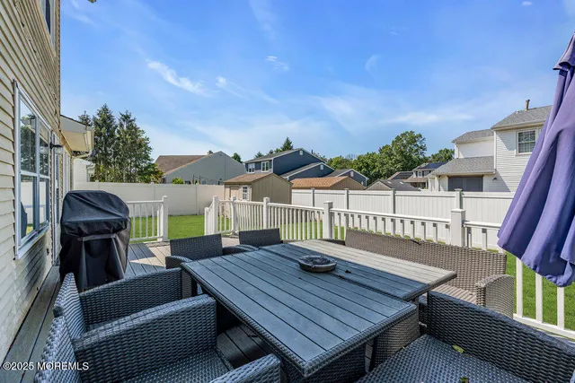 a terrace of a house with outdoor seating