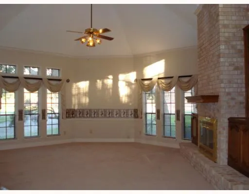 a view of a hallway with chandelier