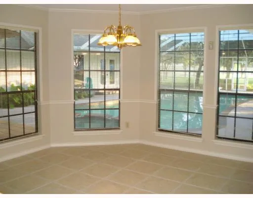 a view of an empty room with a balcony