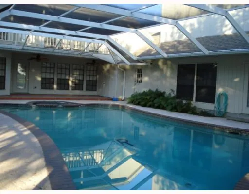a view of a brick building with a swimming pool