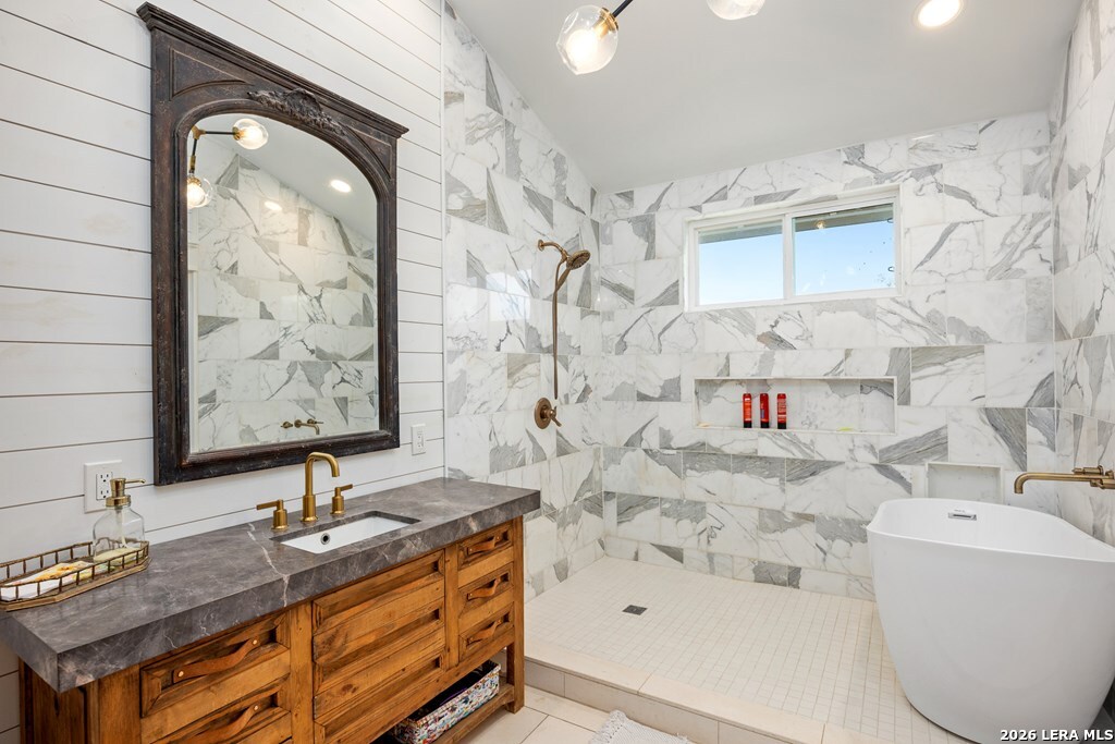 121 Simpson Road Comfort, TX 78013 - Photo 16 of 44 a bathroom with a sink and a mirror