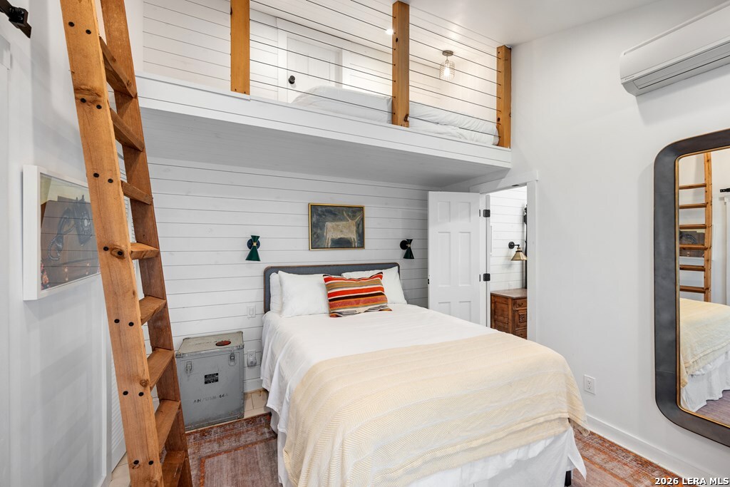 121 Simpson Road Comfort, TX 78013 - Photo 18 of 44 a bedroom with a bed and a window