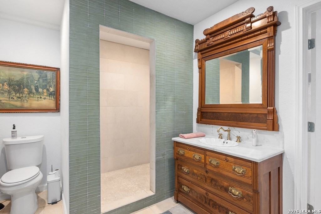 121 Simpson Road Comfort, TX 78013 - Photo 23 of 44 a bathroom with a sink a toilet and mirror