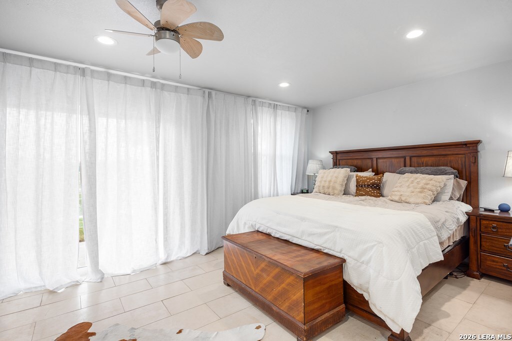 121 Simpson Road Comfort, TX 78013 - Photo 25 of 44 a bedroom with a bed and curtain