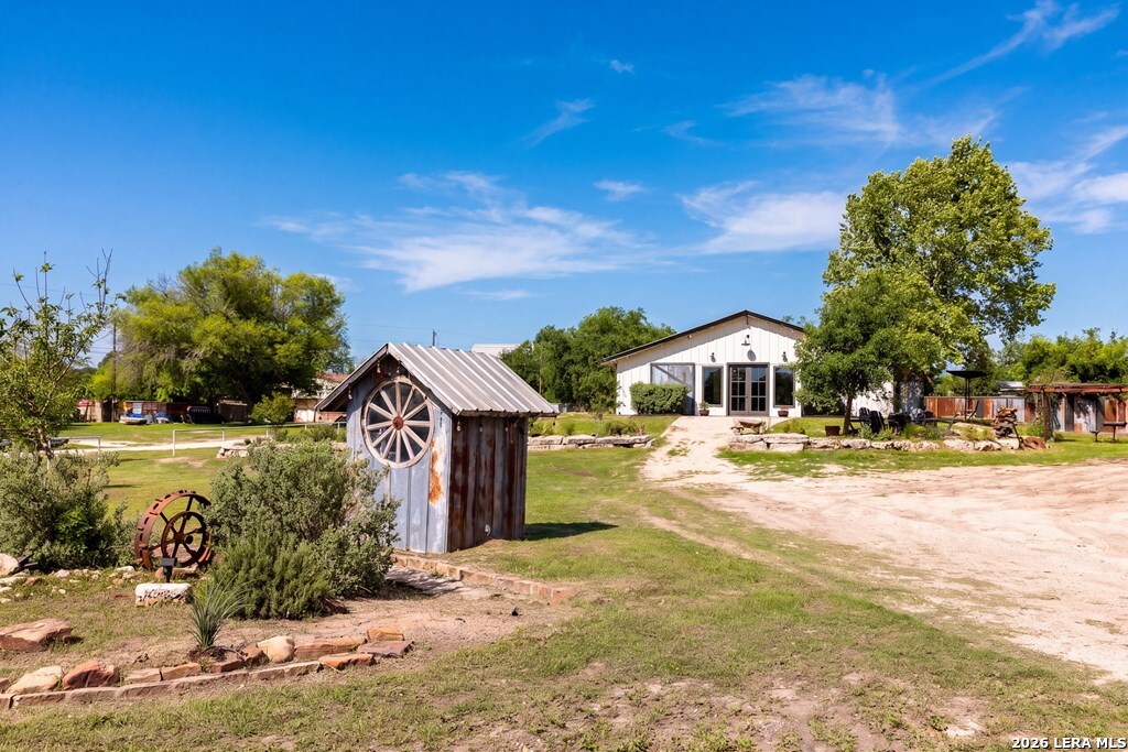 121 Simpson Road Comfort, TX 78013 - Photo 3 of 44 a front view of a house with a yard