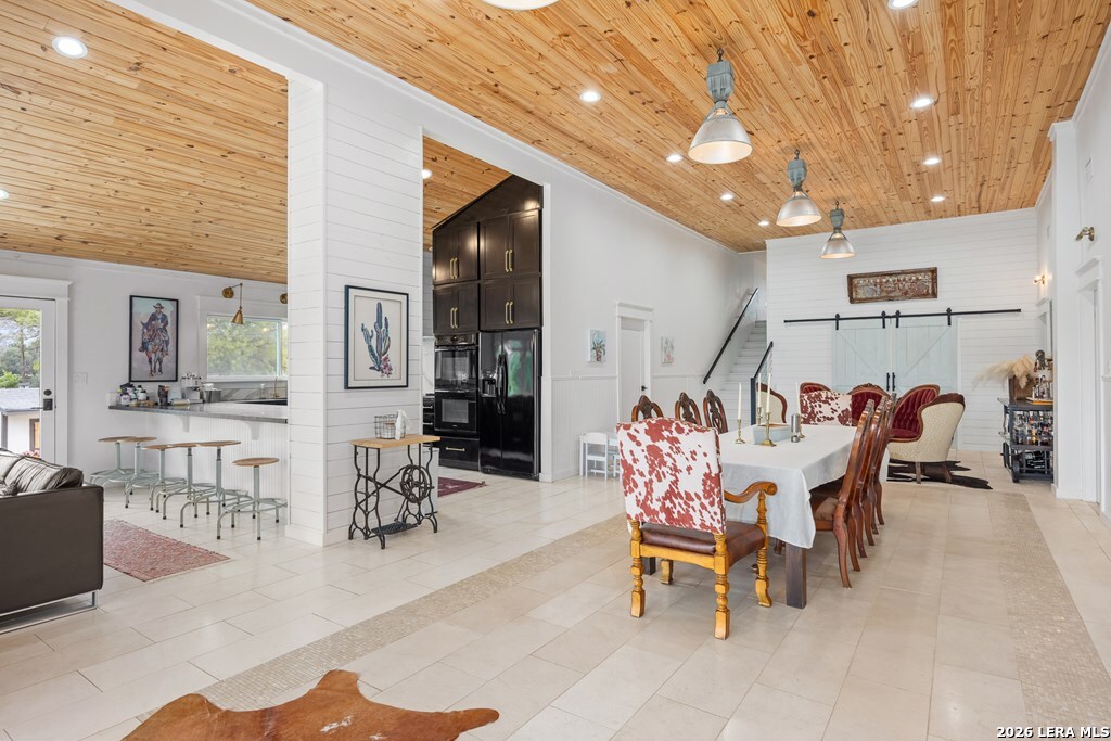 121 Simpson Road Comfort, TX 78013 - Photo 5 of 44 a dining room with furniture and a chandelier