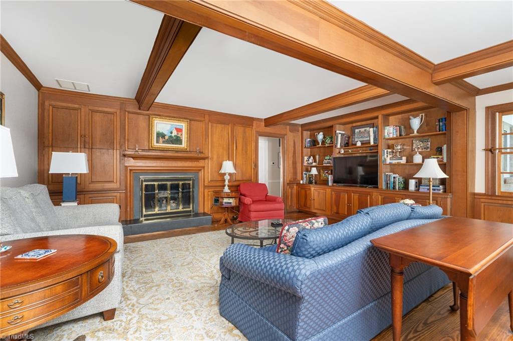 600 Rockford Road Greensboro, NC 27408 - Photo 10 of 35 The woodwork in the den is believed to be mahogany