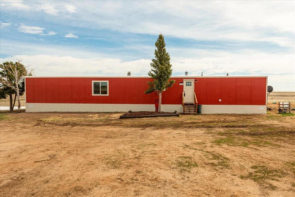 37155 East Jones Road Yoder, CO 80864 - Photo 27 of 48 a view of swimming pool with a yard