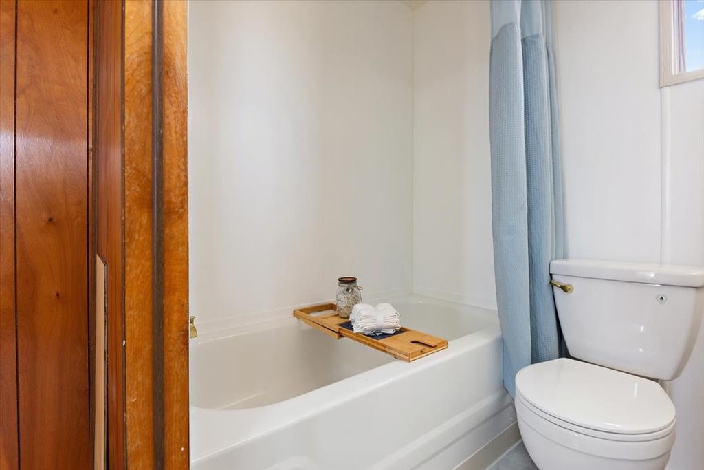 37155 East Jones Road Yoder, CO 80864 - Photo 33 of 48 a white toilet sitting next to a bath tub