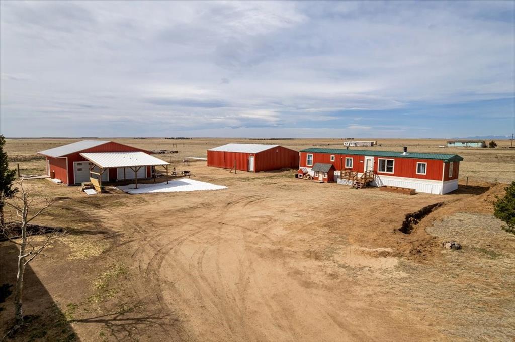 37155 East Jones Road Yoder, CO 80864 - Photo 43 of 48 a view of a swimming pool with an outdoor seating