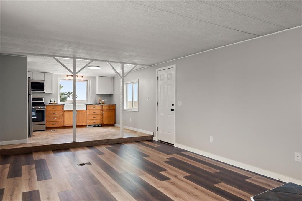 37155 East Jones Road Yoder, CO 80864 - Photo 5 of 48 a view of a room with wooden floor and window