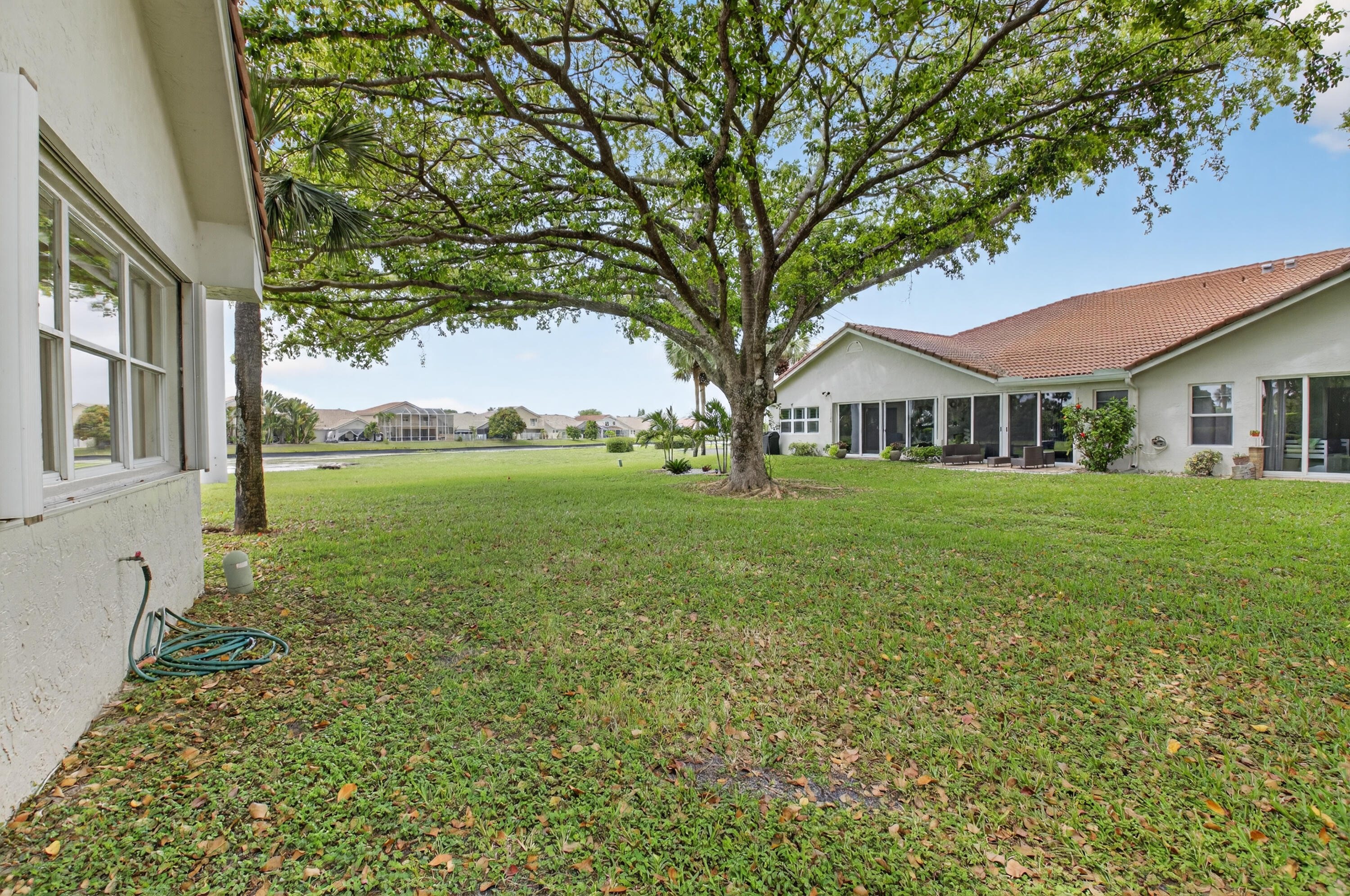 11151 Autoro Court Boca Raton, FL 33498 - Photo 49 of 70 a house view with garden space