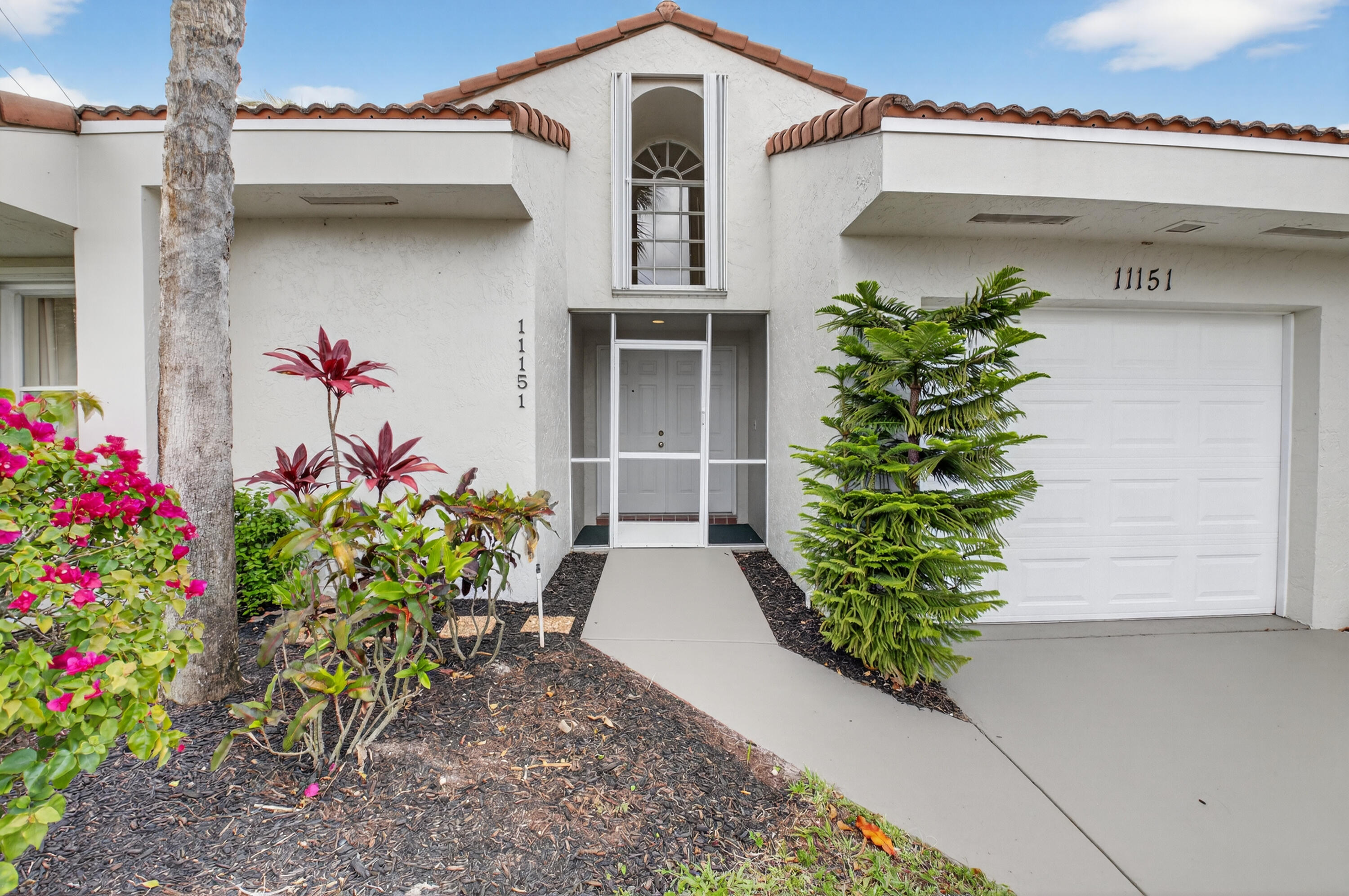 11151 Autoro Court Boca Raton, FL 33498 - Photo 53 of 70 a front view of a house