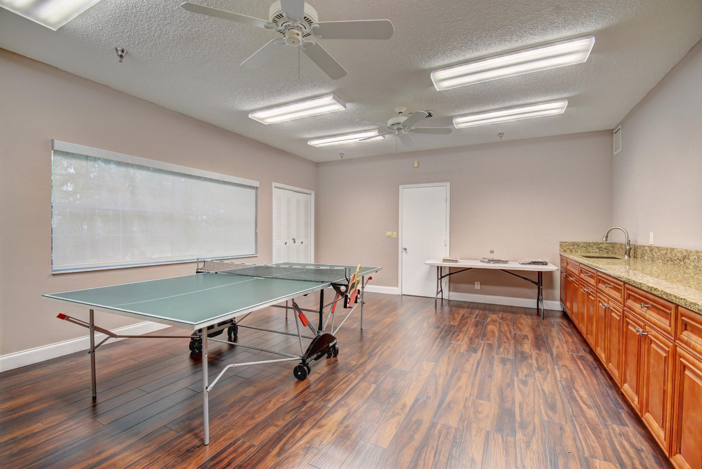 11151 Autoro Court Boca Raton, FL 33498 - Photo 67 of 70 a room with a table chairs and wooden floor