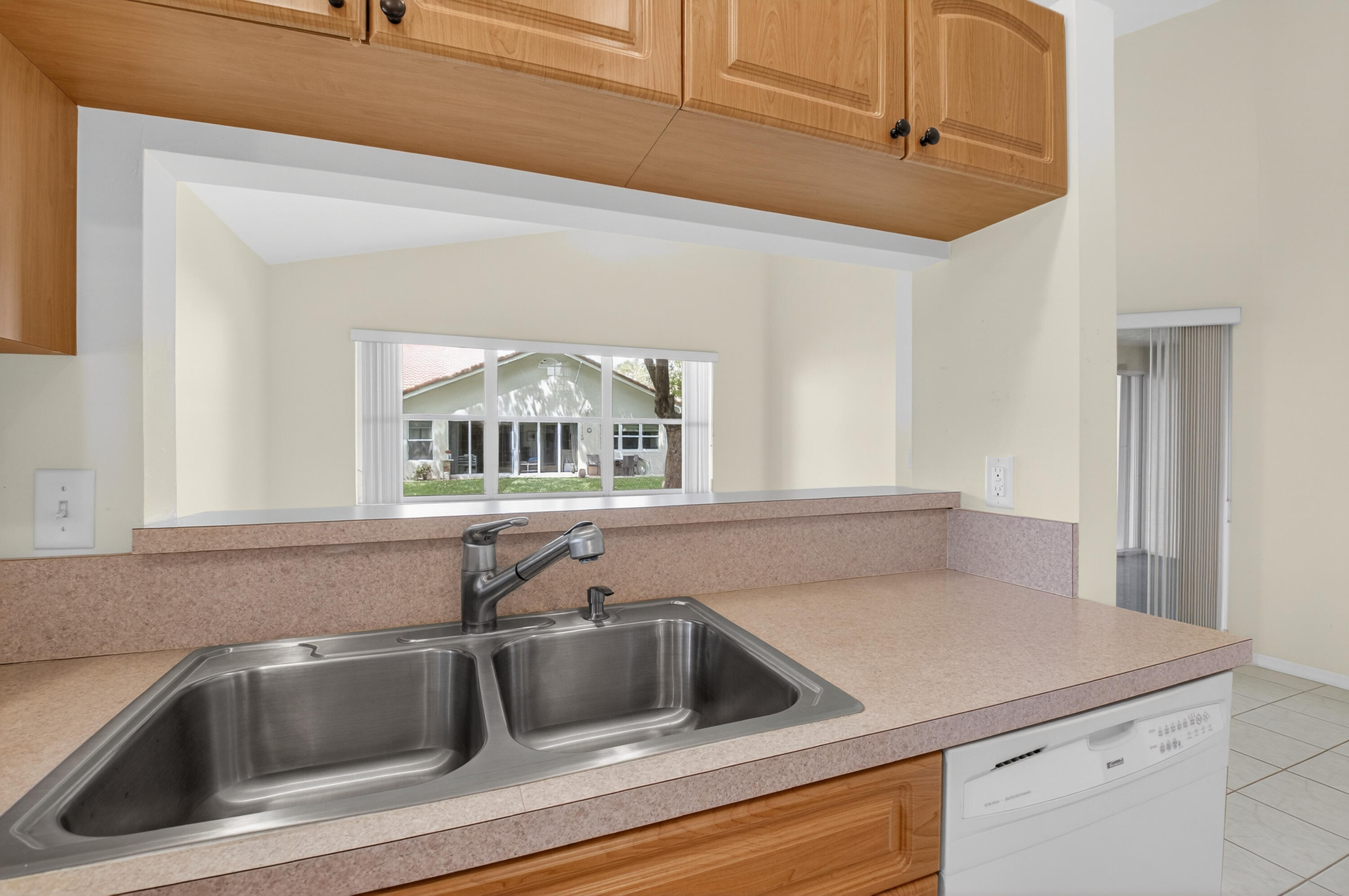 11151 Autoro Court Boca Raton, FL 33498 - Photo 9 of 70 a kitchen with a sink and a window