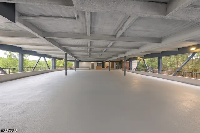 a view of an empty room with a sliding door