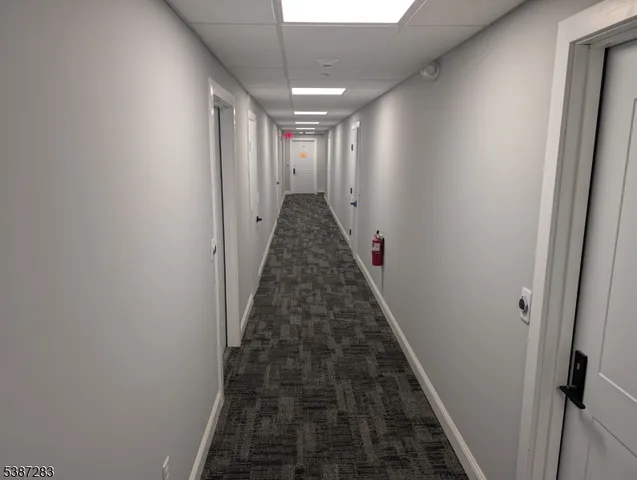 a view of a hallway with a stairs