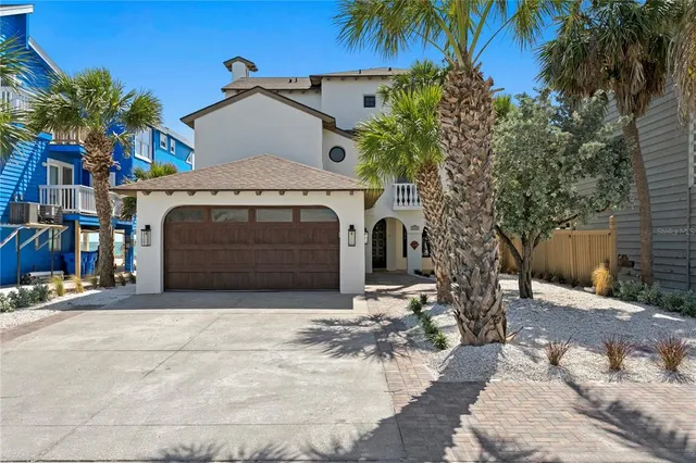 a front view of a house with a garage