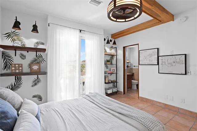 a bathroom with a sink vanity mirror and toilet