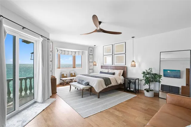 a bedroom with a large bed and a large window