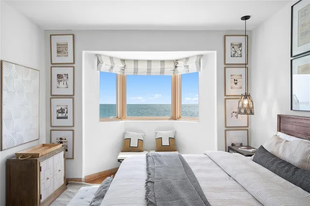 a living room with furniture and potted plant