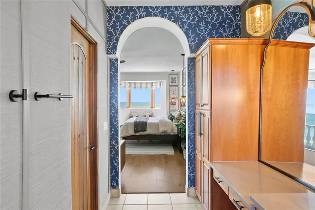 a bathroom with a double vanity sink mirror and bathtub