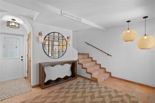 a view of an entryway with wooden floor