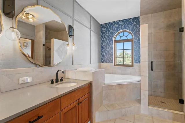 a spacious bathroom with a double vanity sink and a mirror