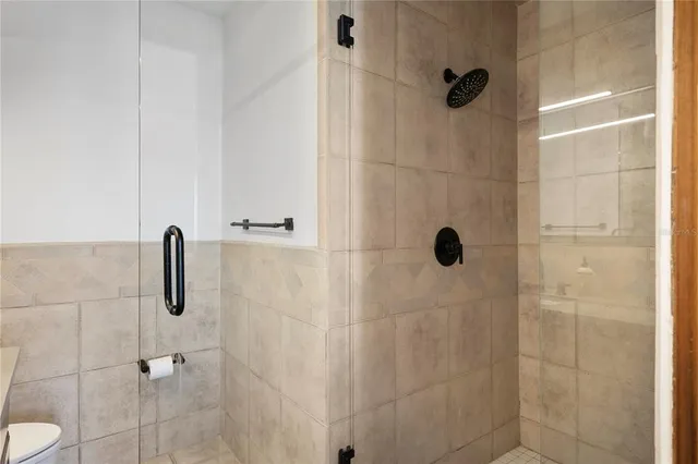 a view of a terrace with furniture and umbrella