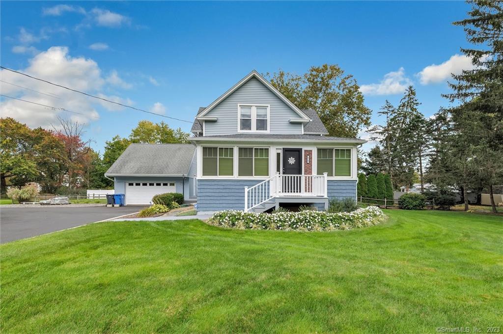 870 Daniels Farm Road Trumbull, CT 06611 - Photo 1 of 1 a front view of a house with a yard and trees