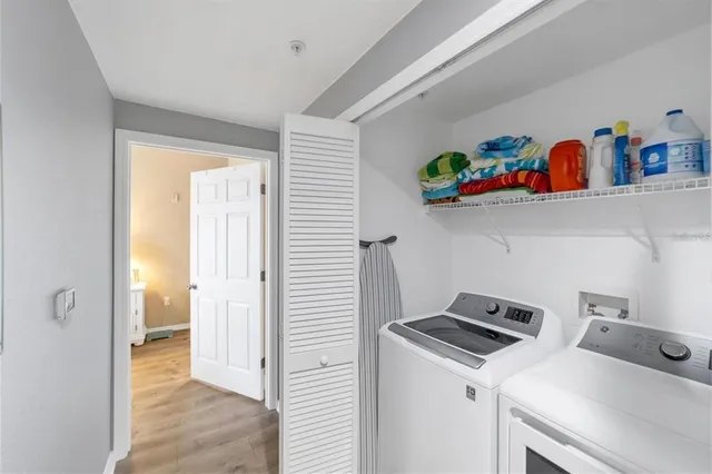 a view of storage and utility room with washer and dryer