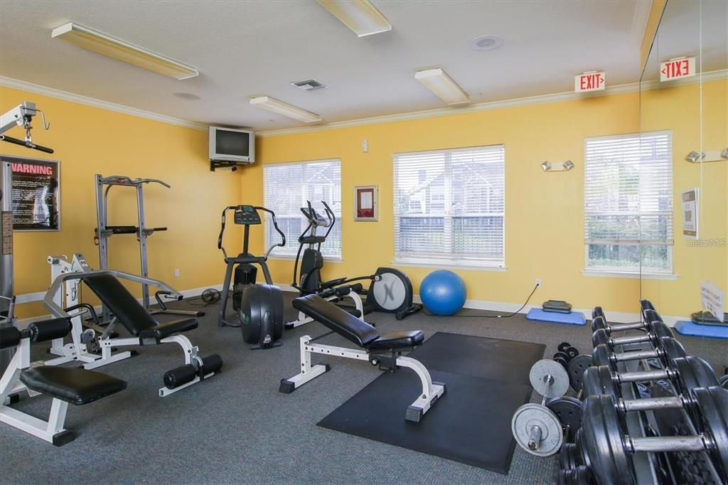 5591 Rosehill Road, Unit 102 Sarasota, FL 34233 - Photo 18 of 20 a room with gym equipment