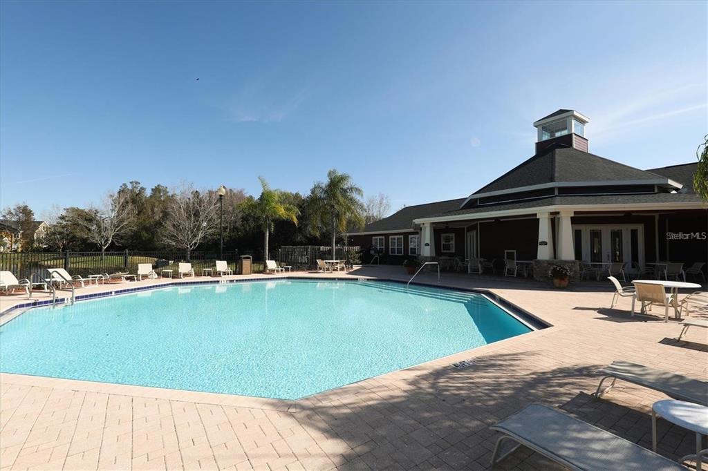 5591 Rosehill Road, Unit 102 Sarasota, FL 34233 - Photo 20 of 20 a view of a house with swimming pool and sitting area