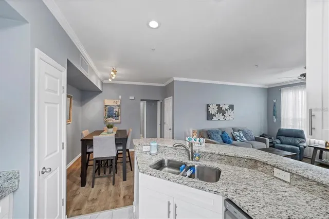 a kitchen with sink and cabinets